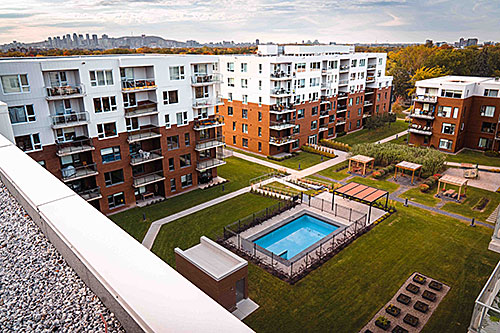 Le projet domiciliaire Loggia St-Lambert était, au moment de sa construction, le premier bâtiment six étages modulaires en structure de bois à être construit au Canada. Crédit : LOGGIA Saint-Lambert