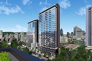 La première tour de 24 étages offrira 211 unités de copropriété. 