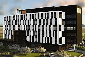 Un immeuble de bureaux vert foncé à Saint-Hyacinthe